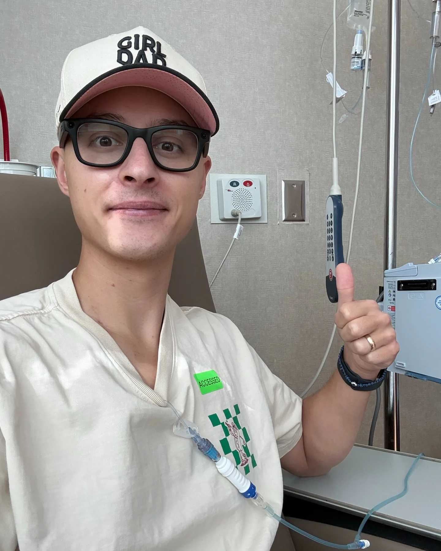 Tyler smiling and giving a thumbs-up from a treatment chair