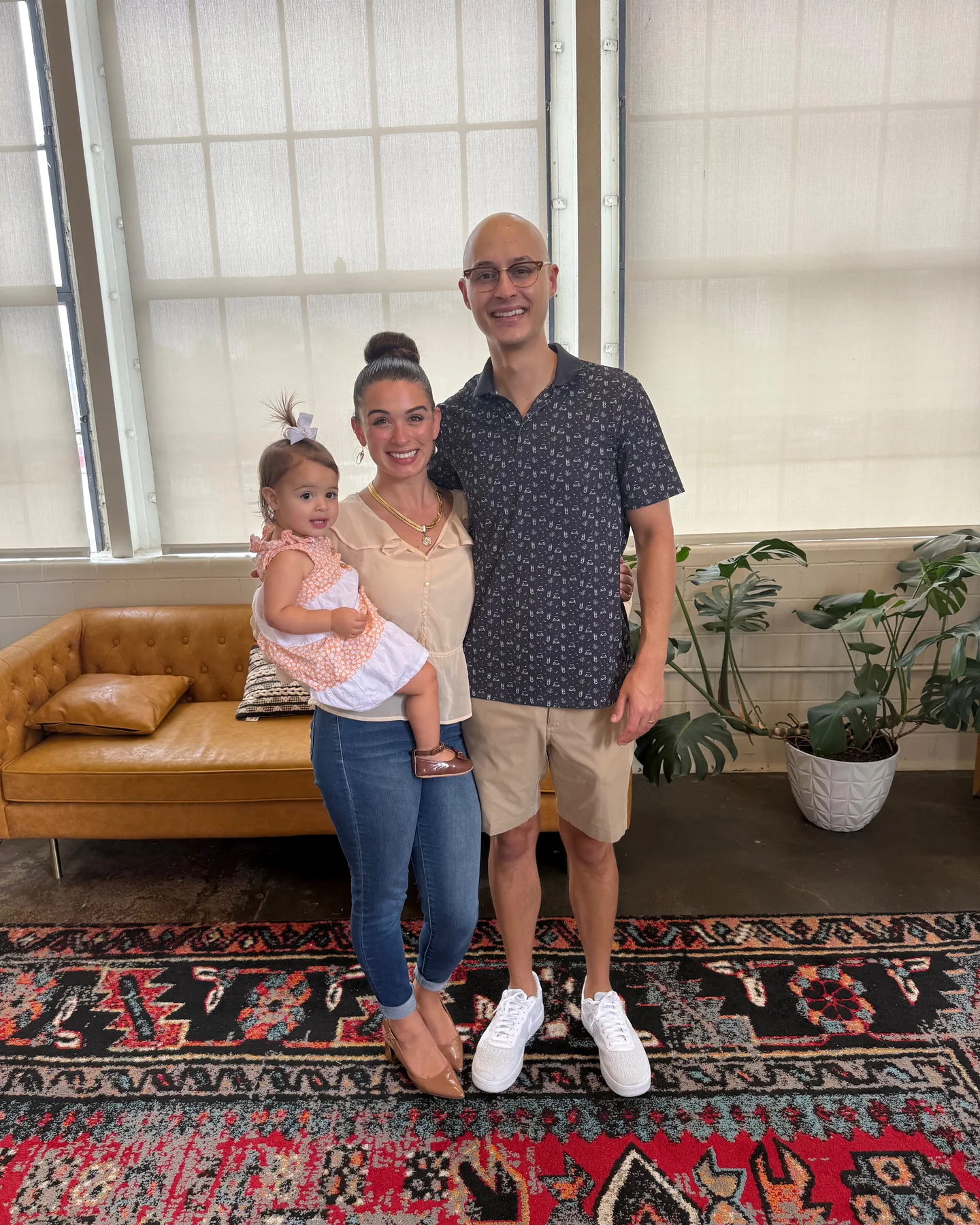 Tyler, Danielle, and Lucia smiling together during their New York City trip