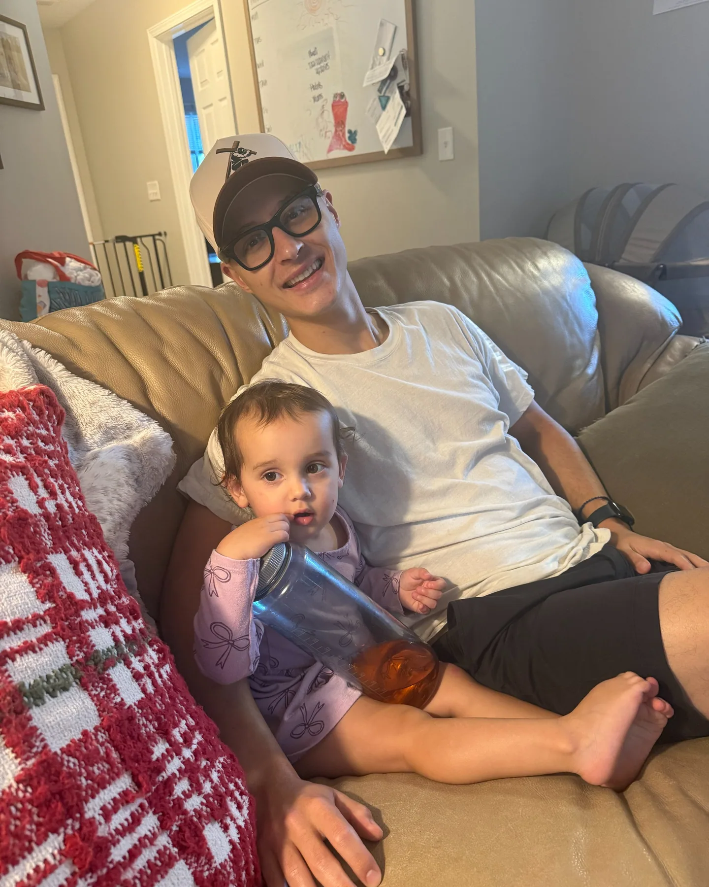 Tyler and Lucia relaxing together on the couch